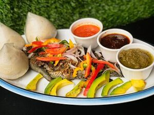 BANKU AND WHOLE GRILLED TILAPIA WITH RIPED PEAR.