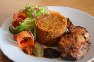 JOLLOF RICE WITH CHICKEN.